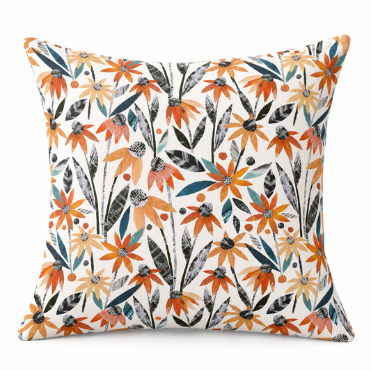 A square throw pillow featuring a vibrant floral pattern with orange, yellow, teal, and gray flowers on an off-white background.