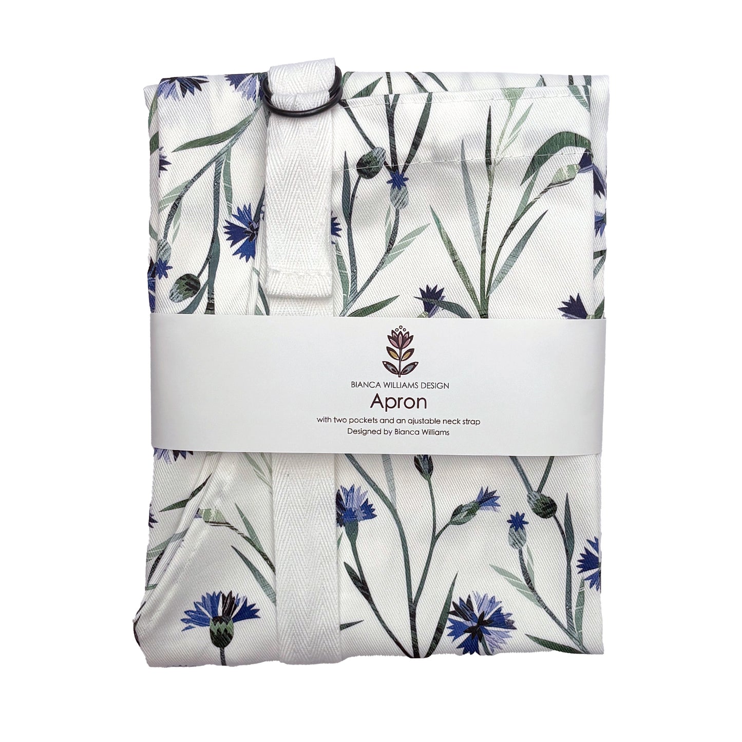 A packaged cornflower apron with white straps has been packaged in a Bianca Williams Design Packaging and placed on a plain white background.