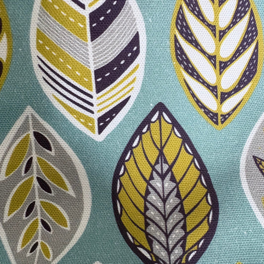 A close up of the blue leaf patterned fabric.