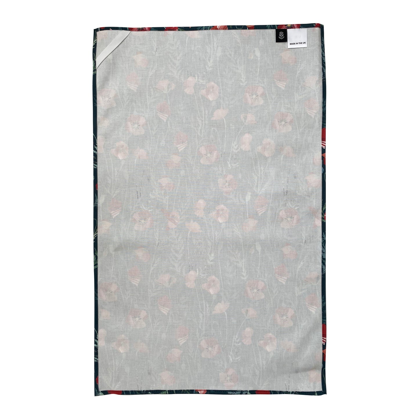 The reverse of a Poppy Tea Towel, showing the hanging loop, care label and brand label.