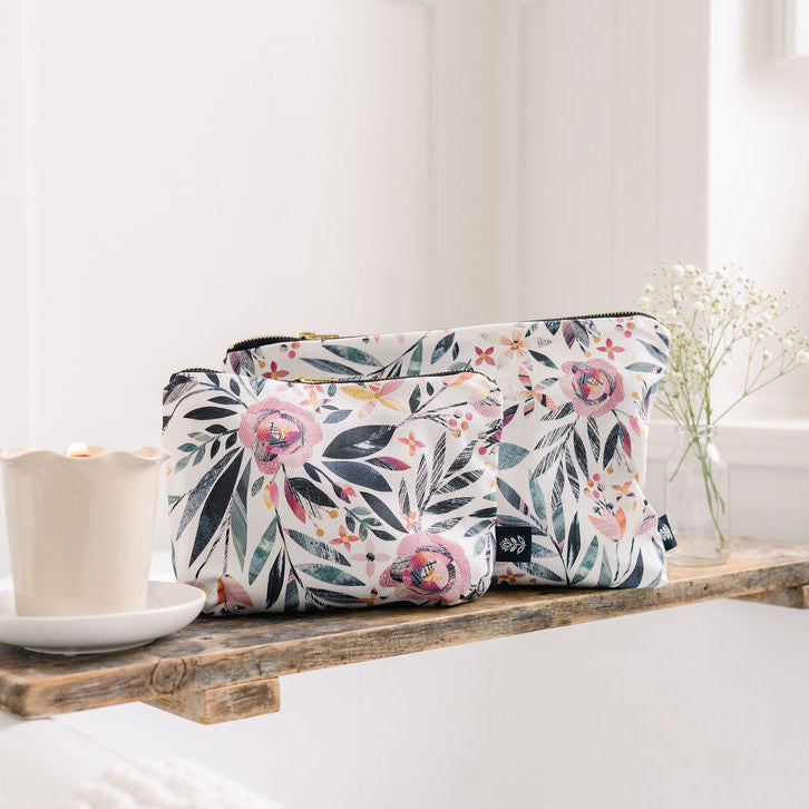 Summer Floral-patterned bag on a wooden shelf with a candle and small plant in a bathroom setting