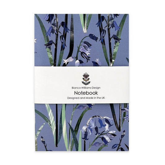 A Bluebell Notebook has been packaged in a branded belly band and has been placed on a white background.