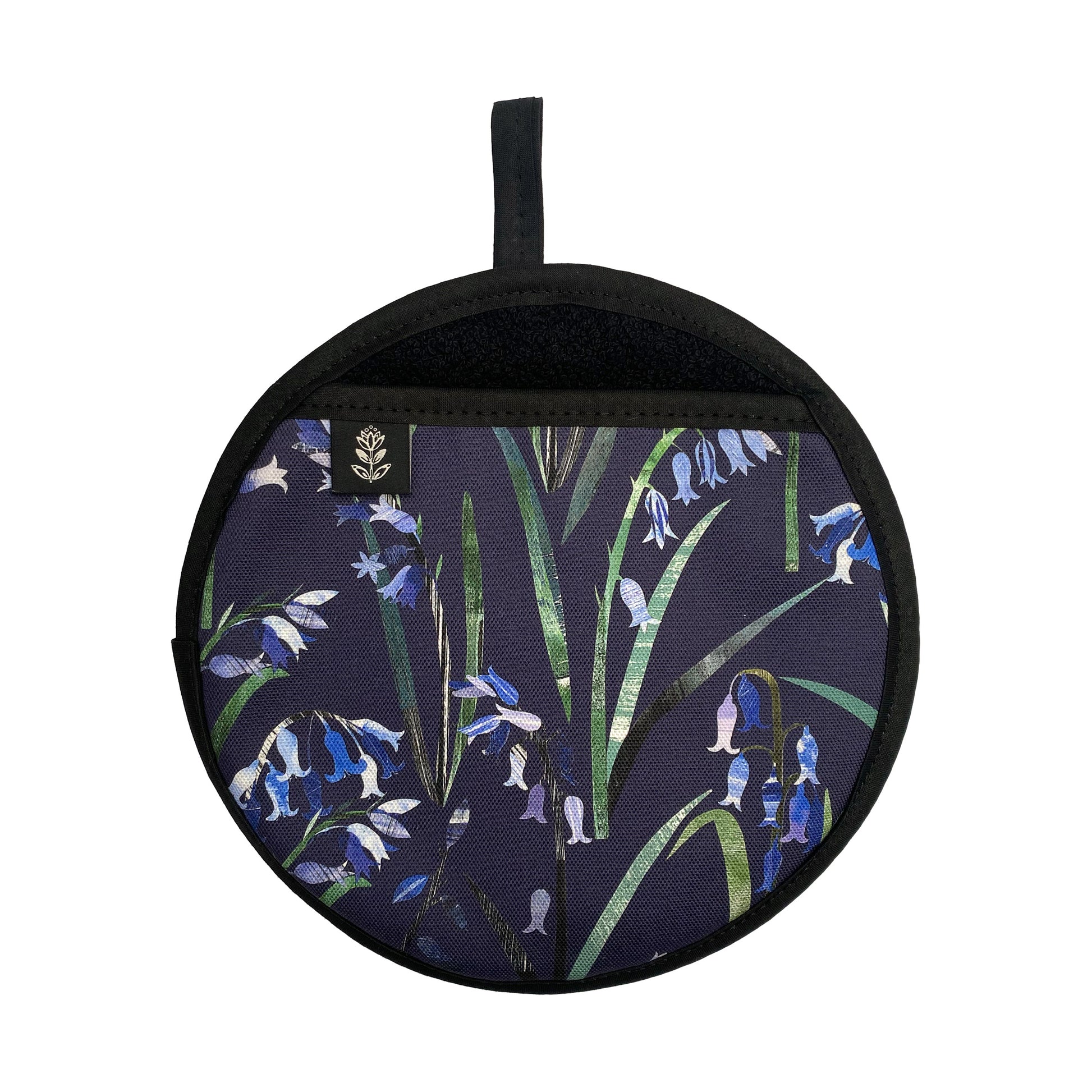 Bluebells Pot Holder featuring the pretty Blue flowers on a Navy Blue background.  The pot grab has a black hanging loop and a brand label sewn onto hand opening.  It has been placed a white background.