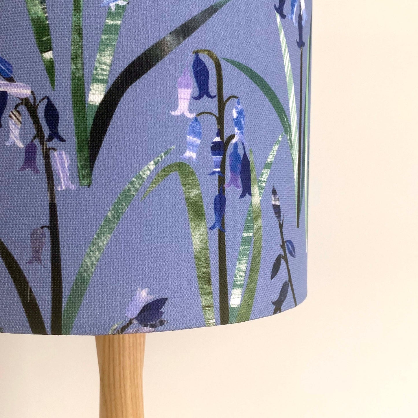 close up of a bluebell lamp shade, showing the textures and tones of the cotton fabric.