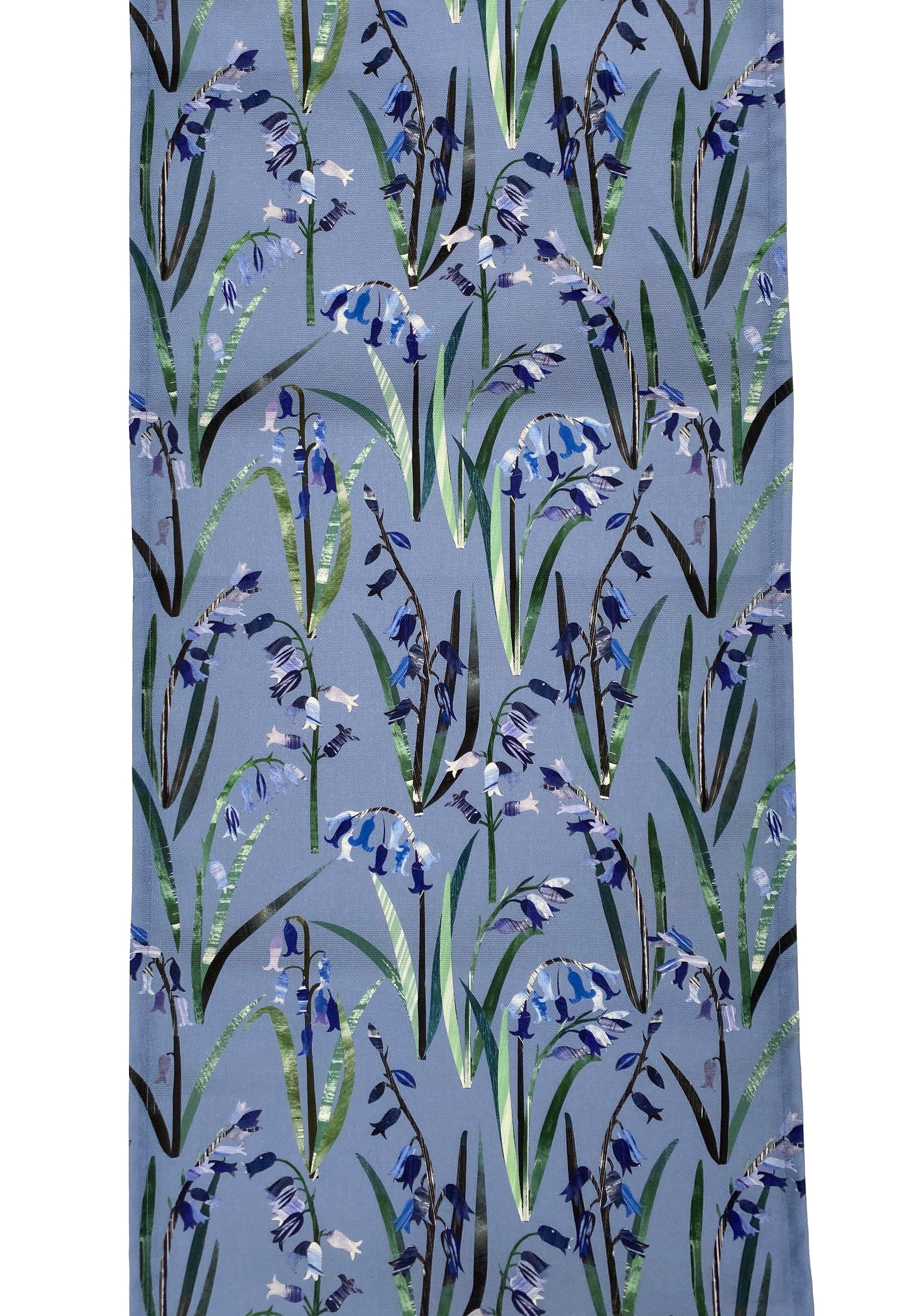 Opened out Bluebell table runner, featuring Bluebell flowers in different textures and shades of blue on a cornflower blue background.