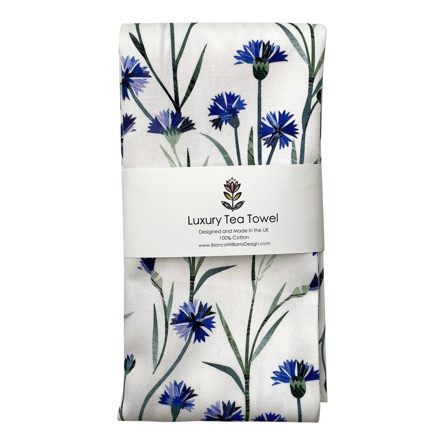 A Cornflower Tea Towel featuring pretty Blue Flowers with green leaves on a white background has been folder up and wrapped in a belly band and has been placed on a white background.