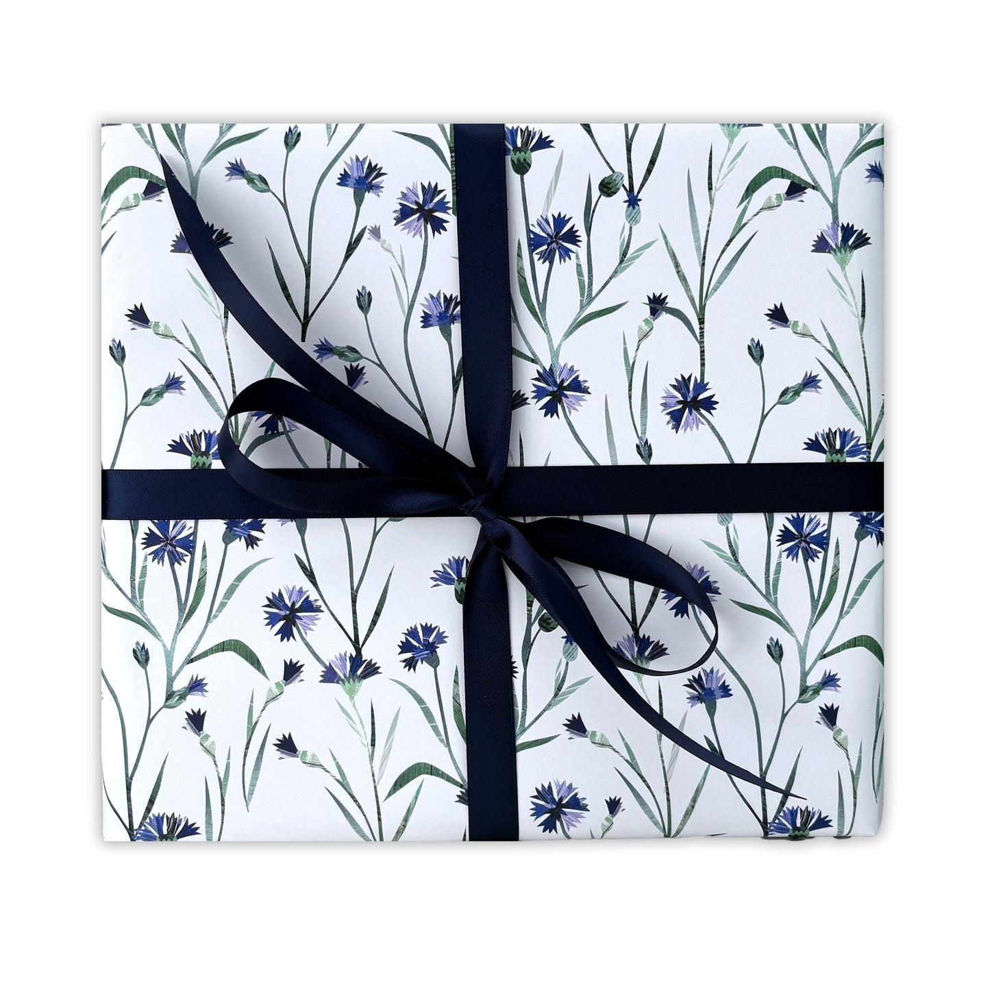 A present has been wrapped in Cornflower Gift Wrap and has been tied with a coordinating Navy satin ribbon and placed on a plain white background.