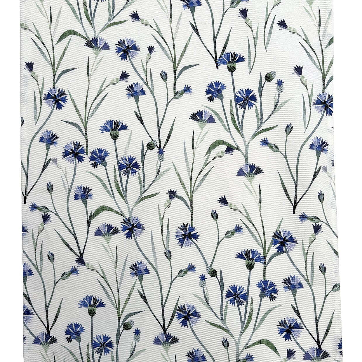 Close up of the Cornflower Table runner showing the pretty blue floral printed pattern on a white background. 