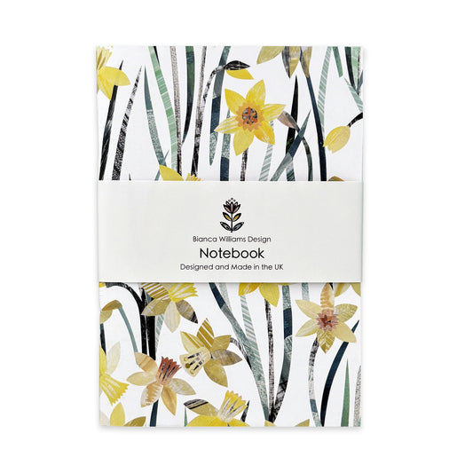 A Daffodil Notebook has been packaged in a branded belly band and has been placed on a plain white background.