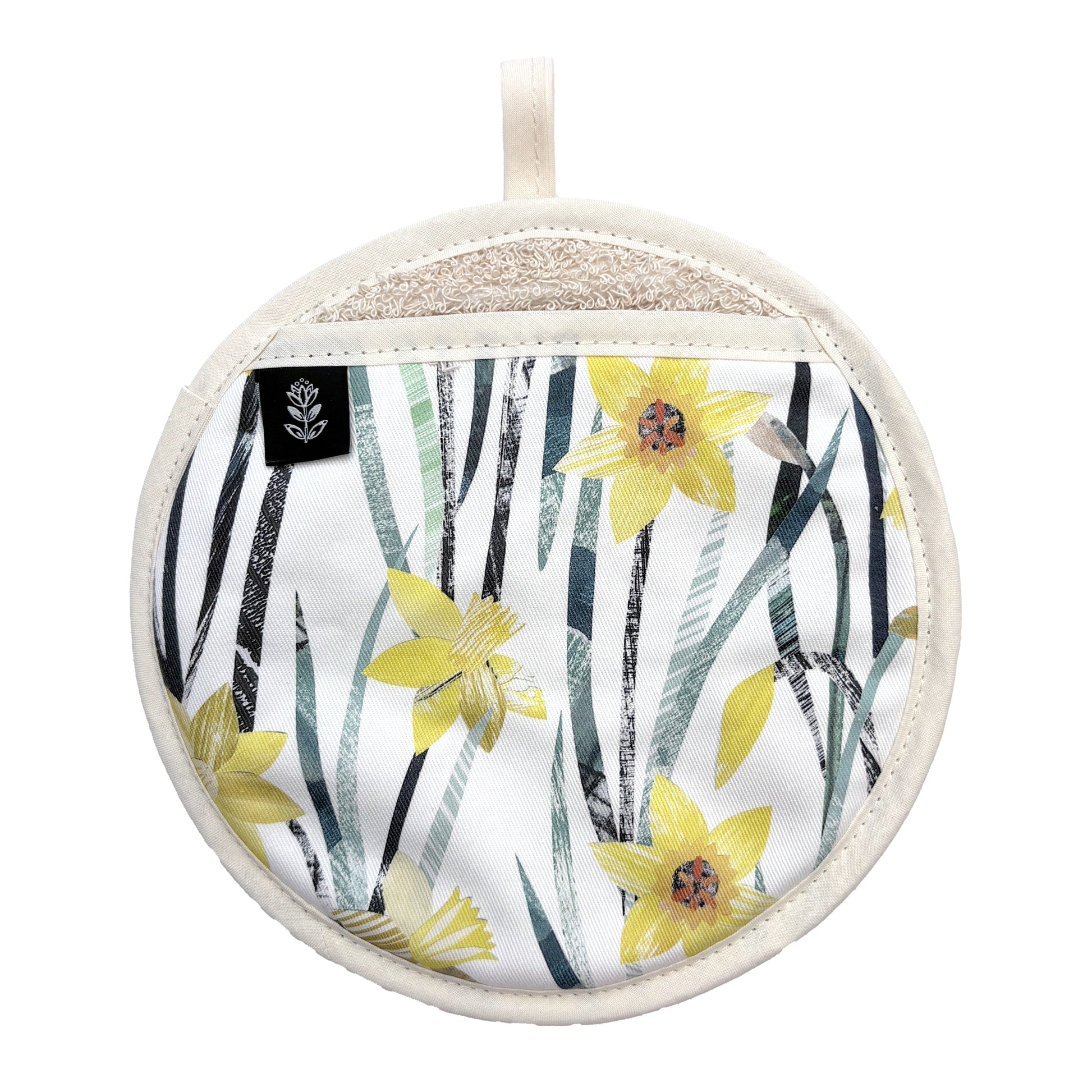 A round potholder with a white background, yellow daffodil flowers, and blue-green leafy stems. Has been placed on a white background.