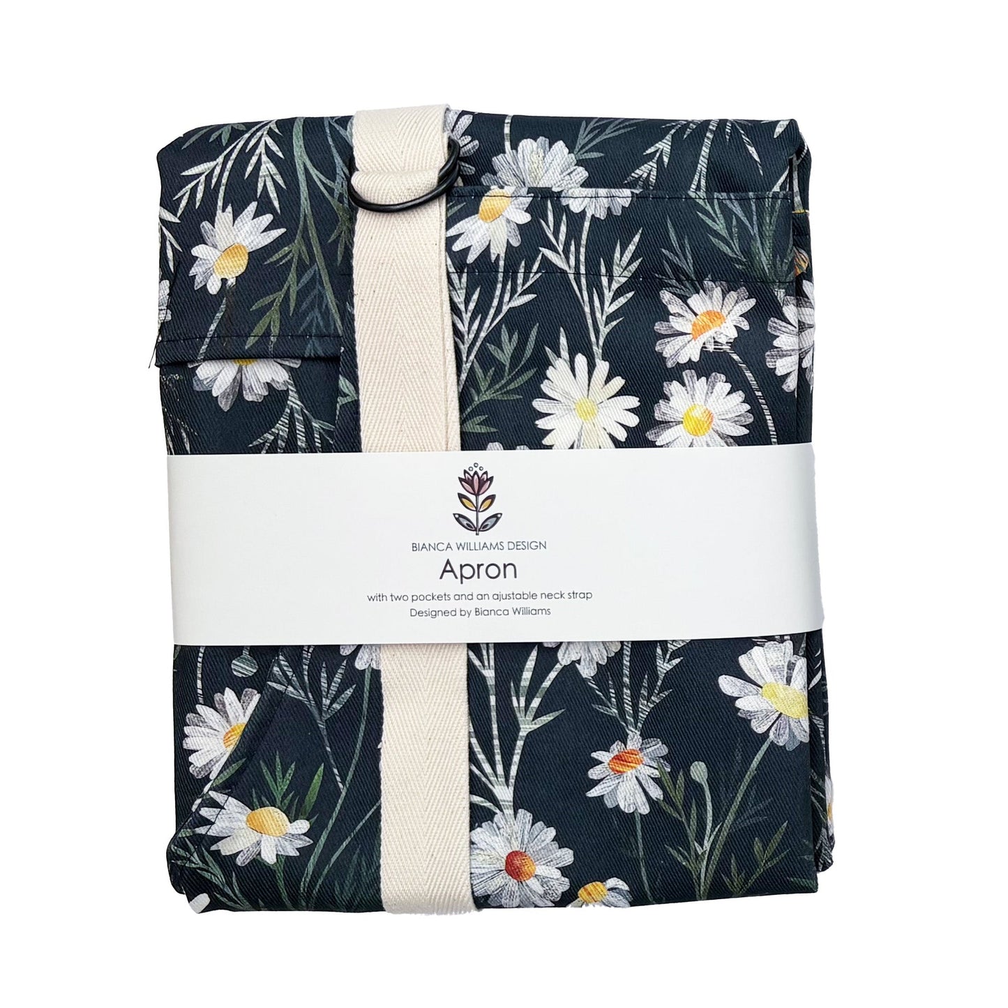 A packaged Daisy apron with Ecru straps has been packaged in a Bianca Williams Design Packaging and placed on a plain white background.