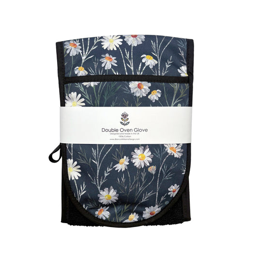 Daisy Double Oven Gloves have been packaged in a branded belly band and placed on a plain white background.
