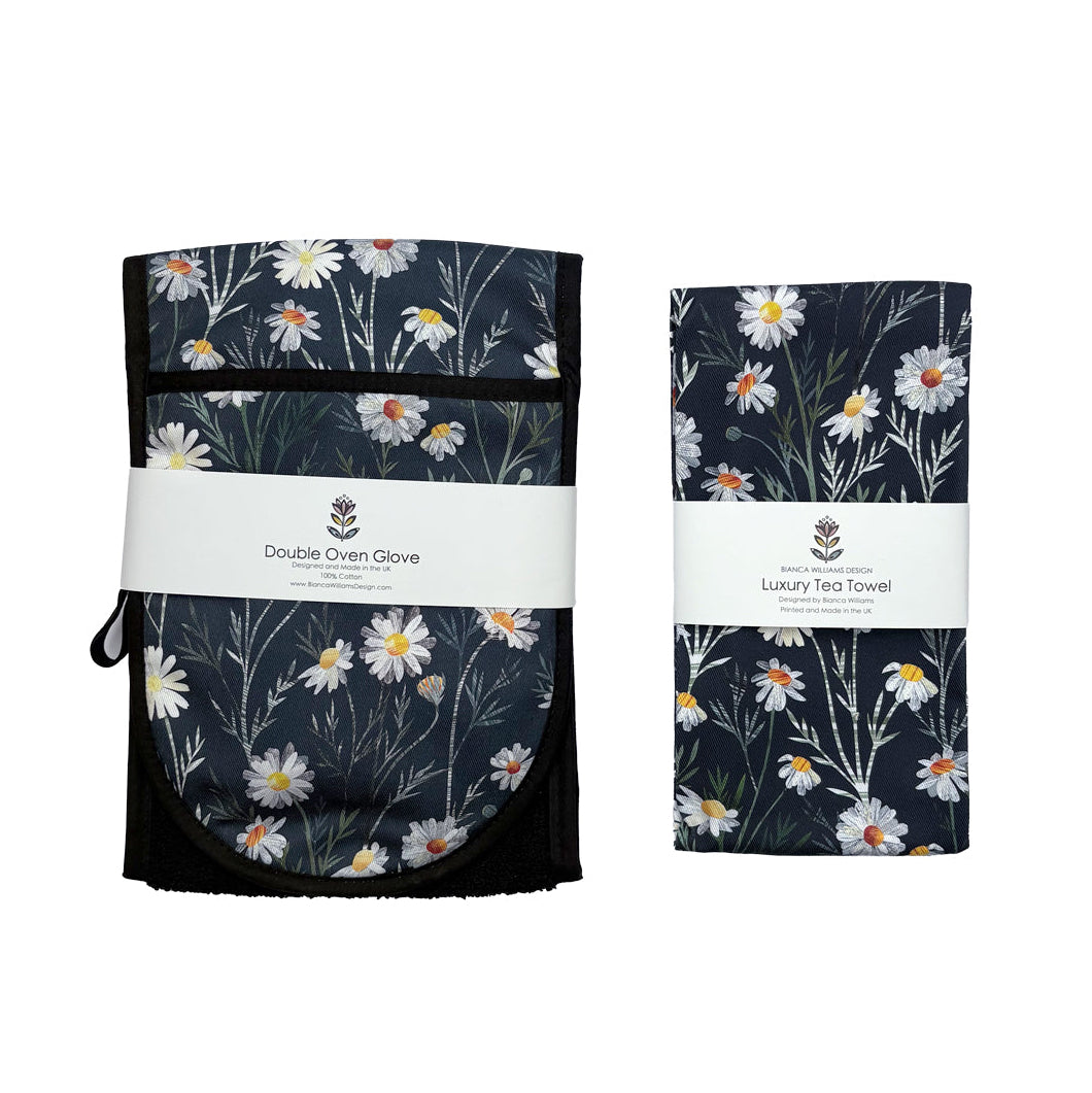 Set of matching Daisy Tea towel and Double oven glove with branding on a white background.