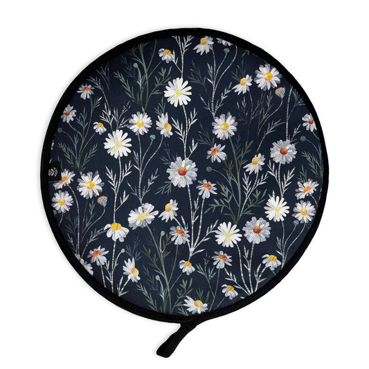A Daisy Aga cover has been placed on a plain white background.  It features a pretty white Daisy pattern with green textured leaves on a dark Navy Blue background.