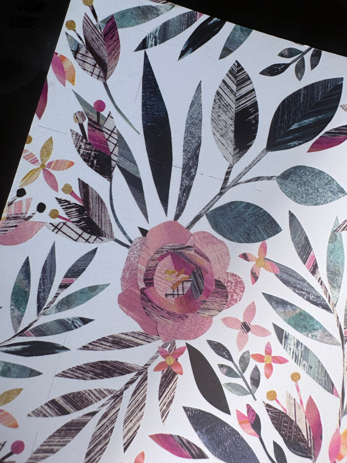 Close up of the summer floral notebooks showing the slight printing flaw in the pattern.