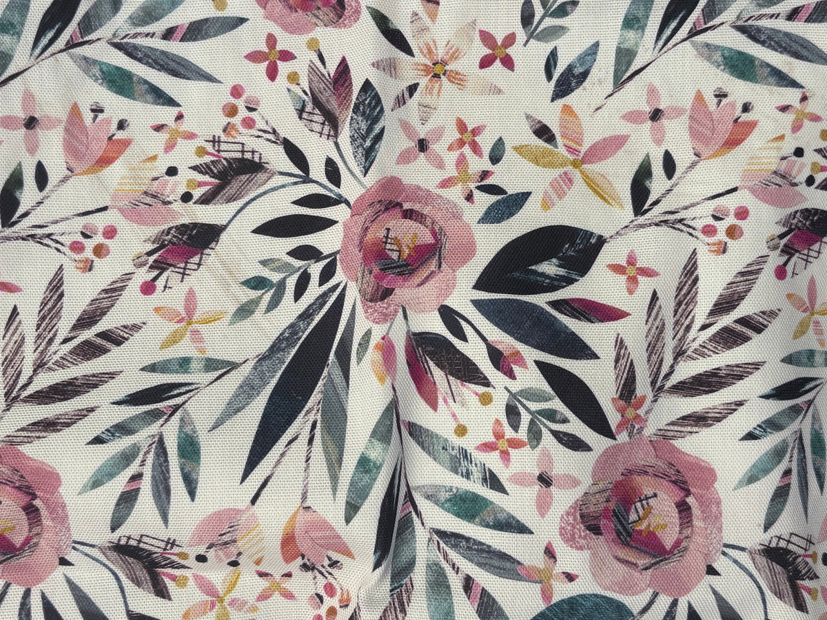 A close-up of a floral fabric print featuring pink roses, dark navy leaves, and small yellow and orange blossoms on an off-white background.