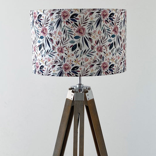 Summer Floral Large lampshade featuring Pink Roses and green leaves. Reminiscent of an English Cottage Garden.  It has been displayed here on a wooden floor standing tripod base lamp.