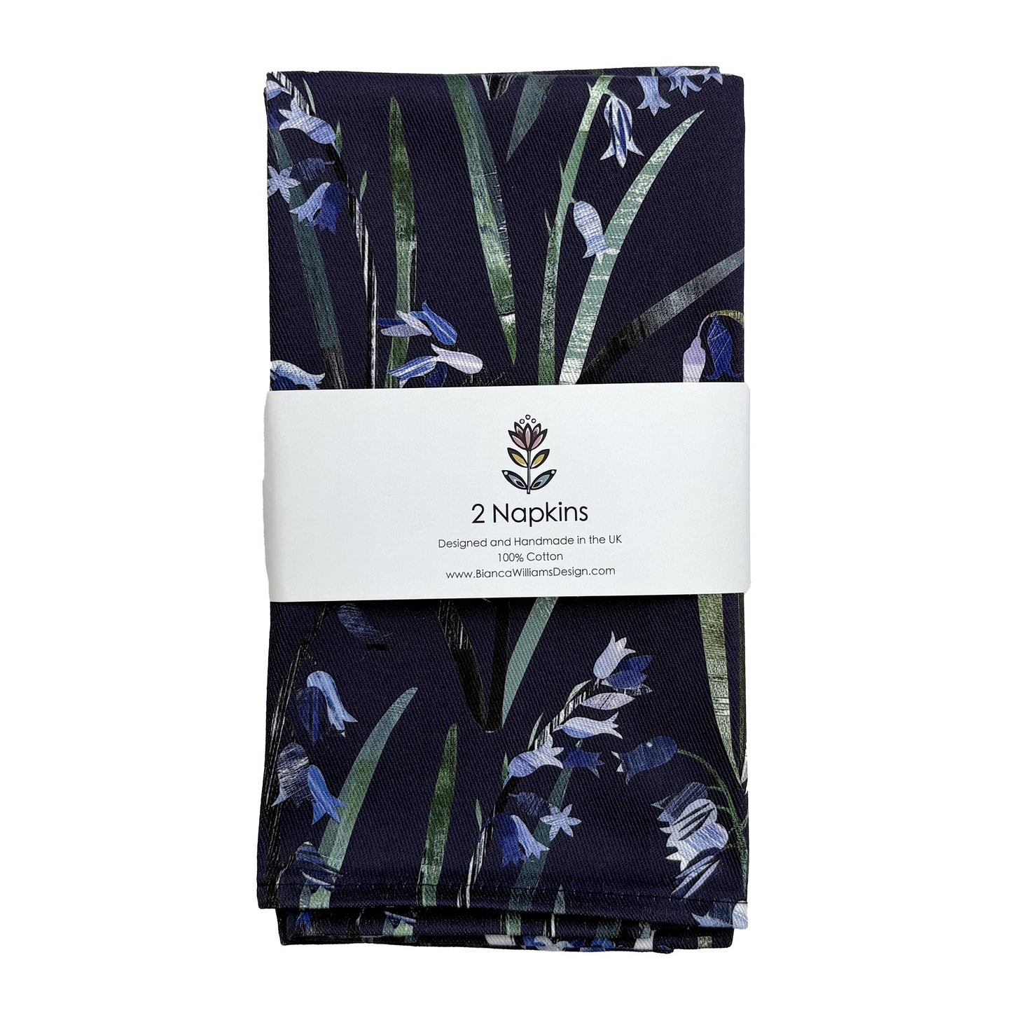 Pack of two navy Blue Bluebell cotton napkins have been folded up and packaged in a branded bally band and they have been placed on a plain white background.