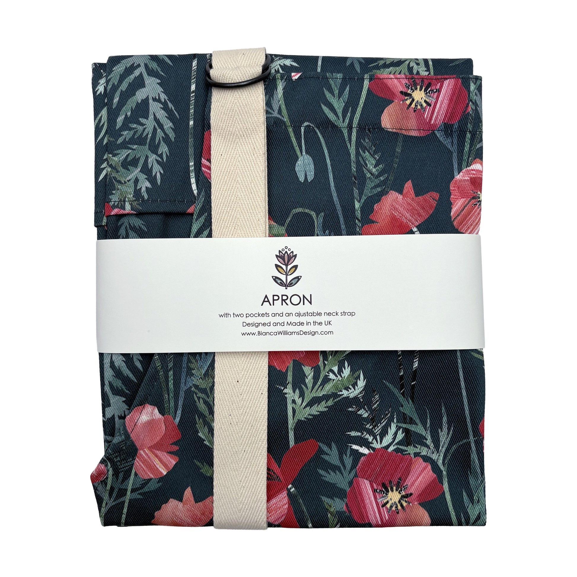 A packaged poppy apron with ecru straps has been packaged in a Bianca Williams Design Packaging and placed on a plain white background.
