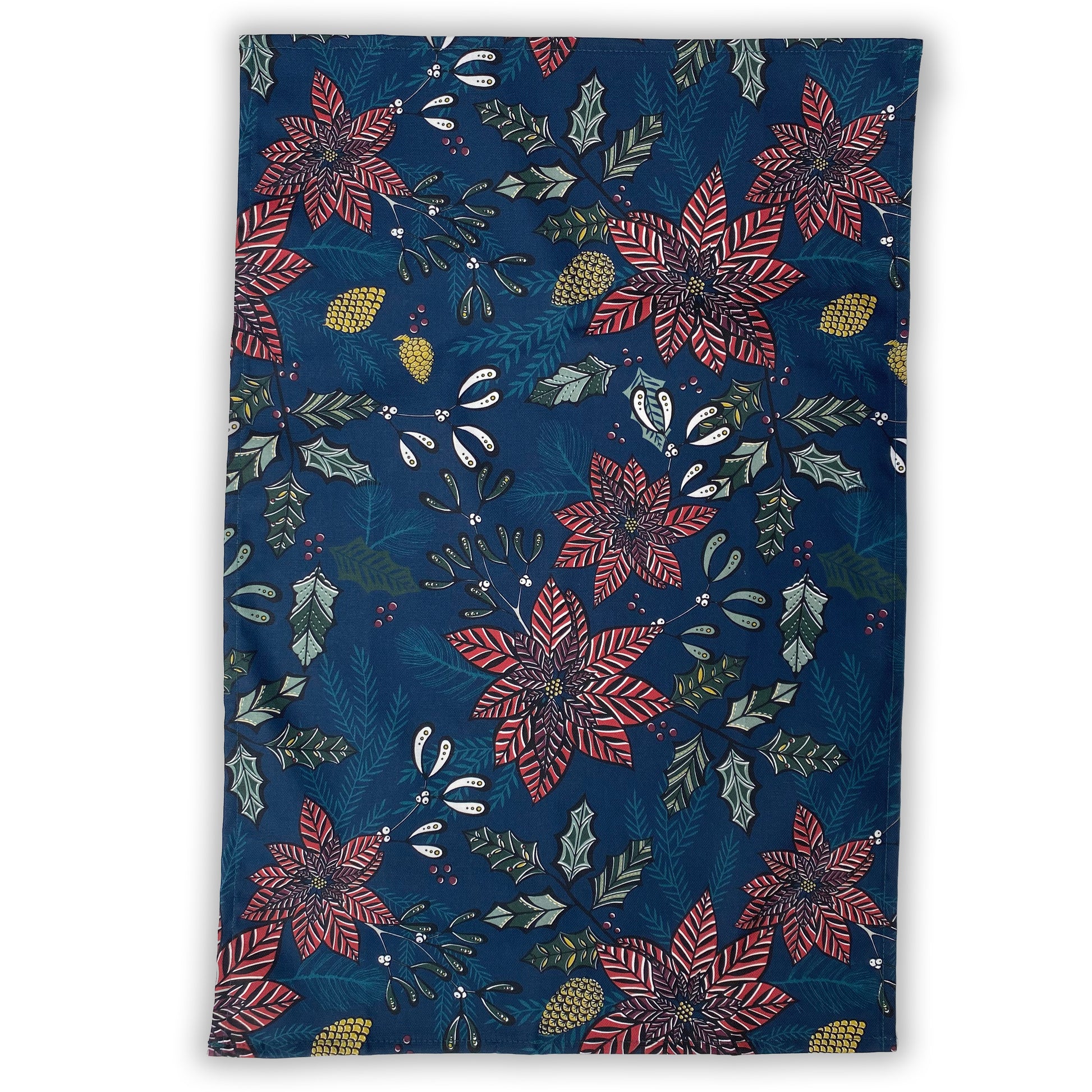 An opened out Navy Poinsettia tea towel featuring Red Poinsettia Flowers and Green Holly, Mistletoe and fir and gold pinecones.  It has been placed on a white background.