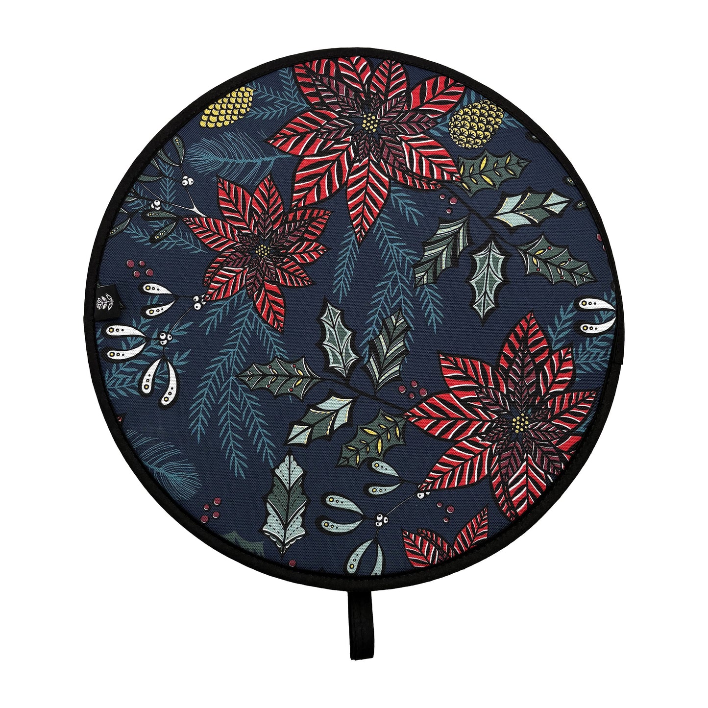 Christmas Chef pad has been placed on a wooden table.  It features red poinsettia flowers, green holly, fir, mistletoe and yellow pinecones on a navy background.