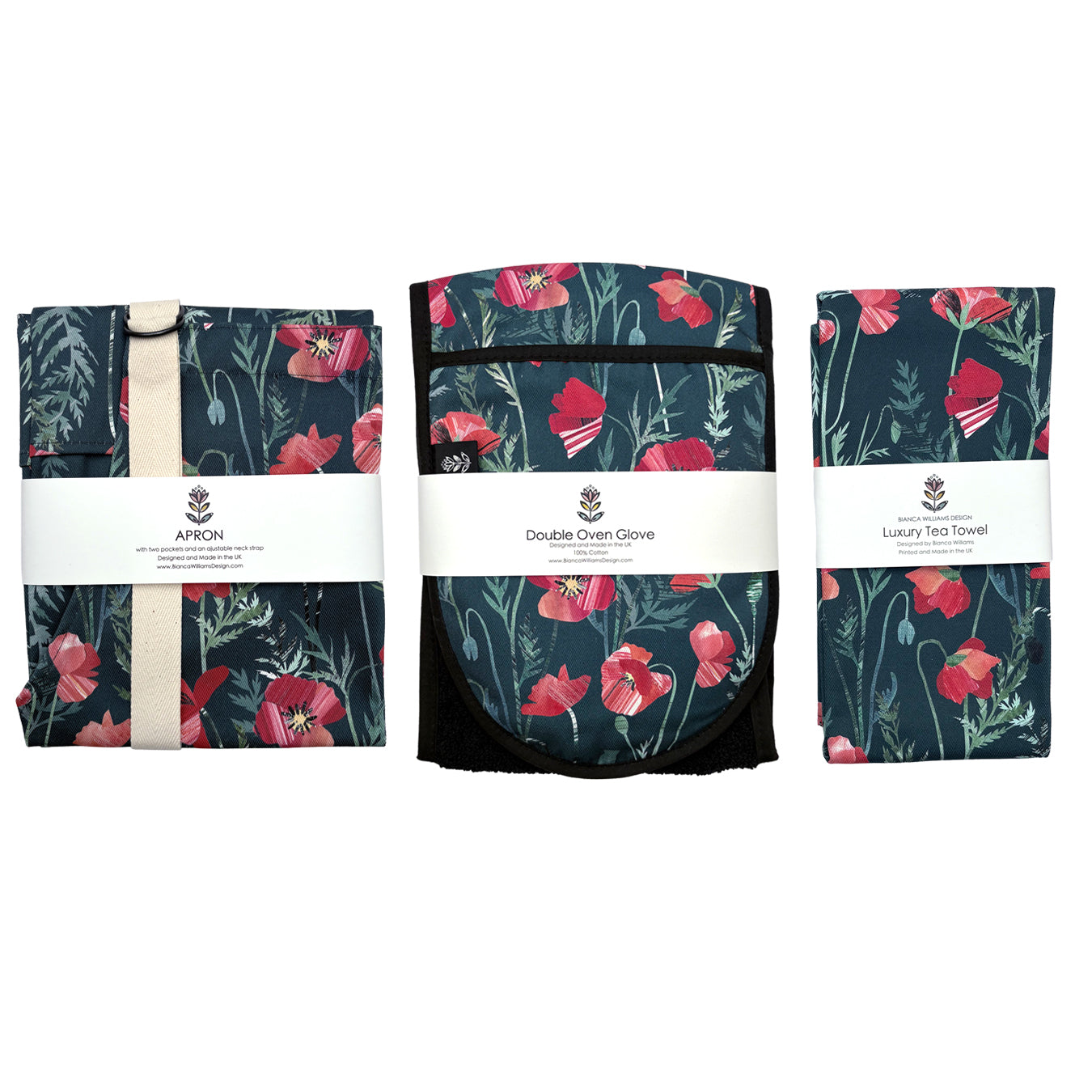 Set of Red Poppy floral patterned kitchen items including a tea towel, oven glove, and spoon on a white background.