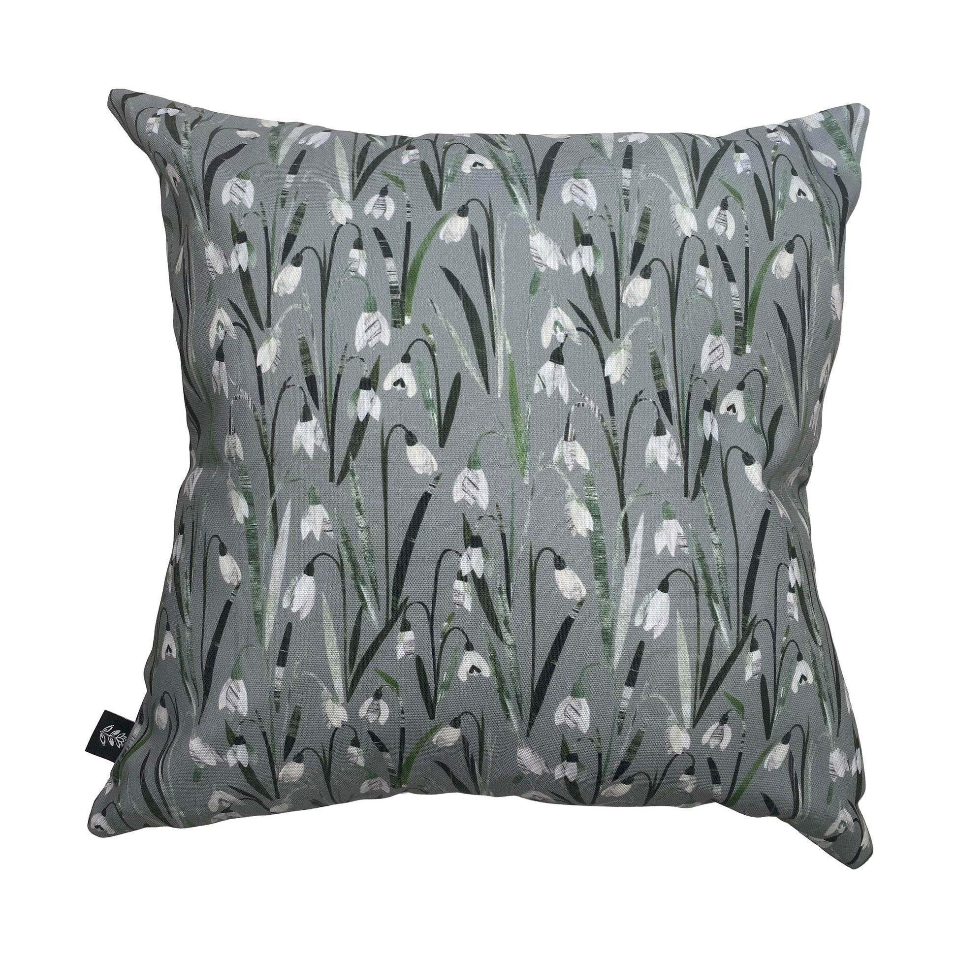 A Snowdrop Cushion on a plain white background.