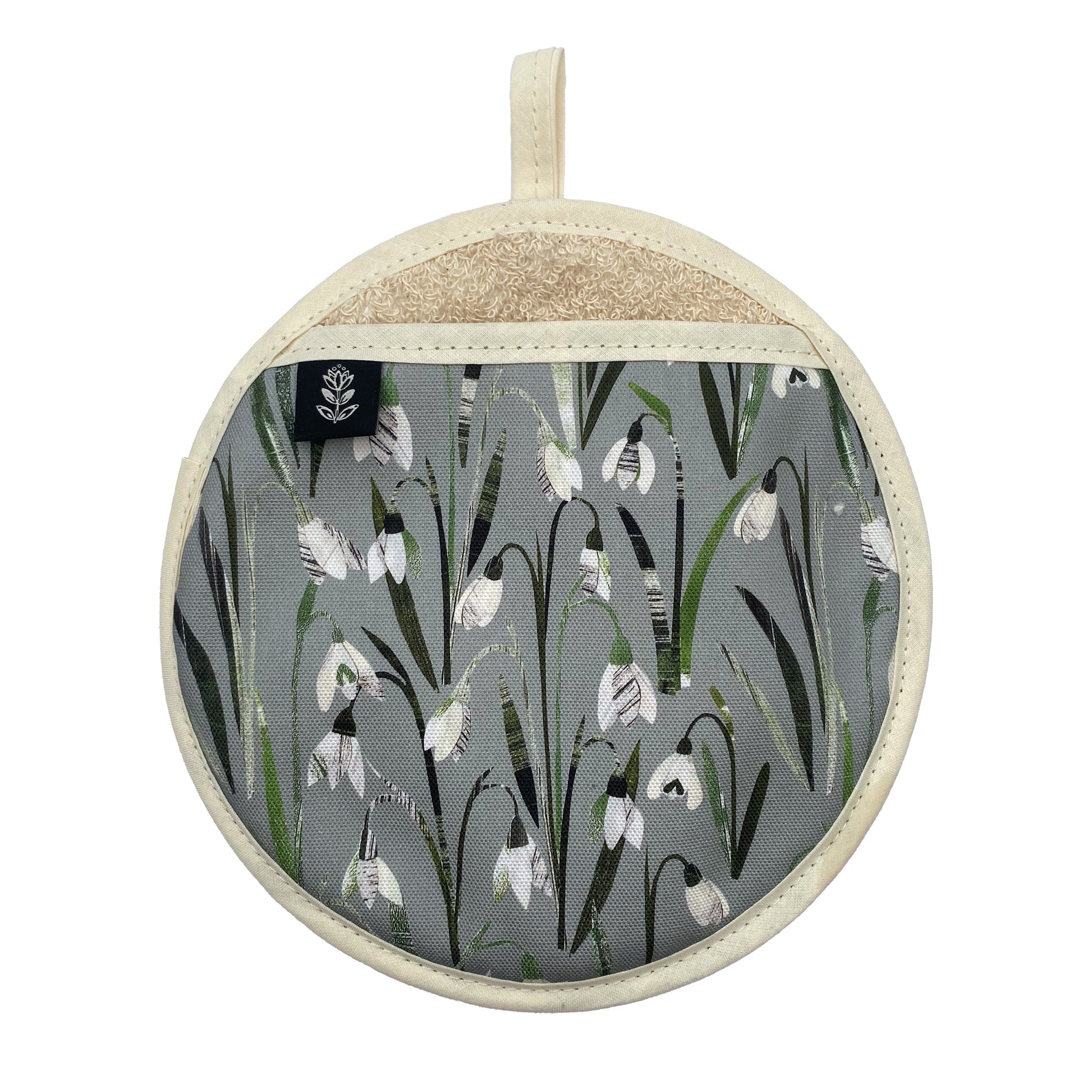 Snowdrops Pot Holder featuring the pretty little cream and white flowers on a sage green background.  The pot grab has a cream hanging loop and a brand label sewn onto hand opening.  It has been placed a white background.