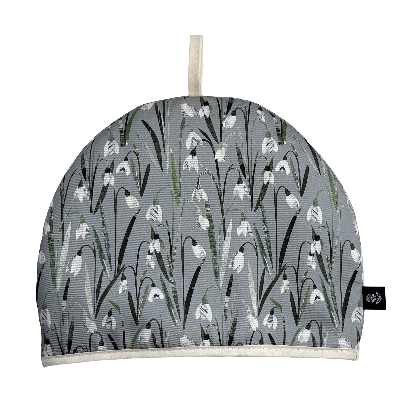 Snowdrop Tea cozy with white floral pattern on a white background.