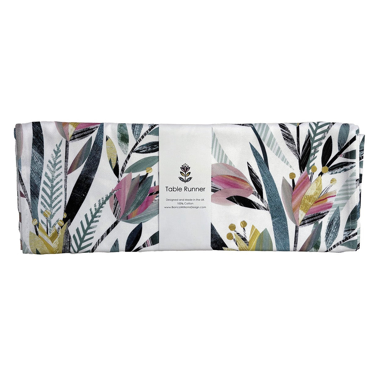 Colourful Tulip Floral patterned table runner folded and packaged in a branded white belly band and placed on a white background.
