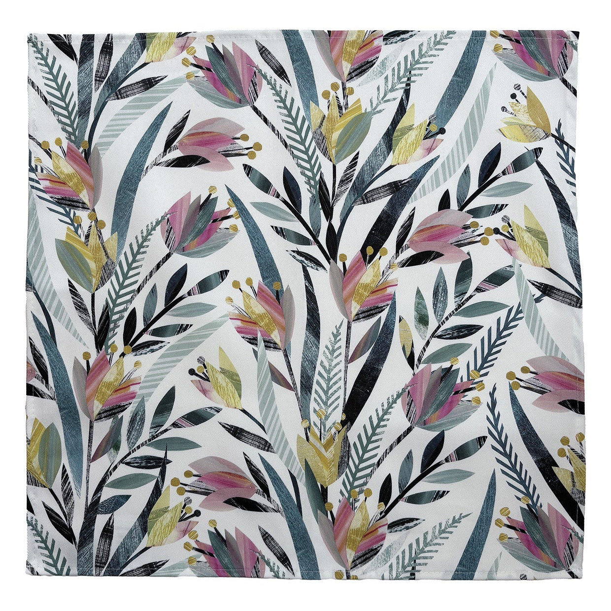 A colourful napkin featuring pink, yellow and green tulips with green leaves on a white background has been opened out and laid flat on a plain white background.