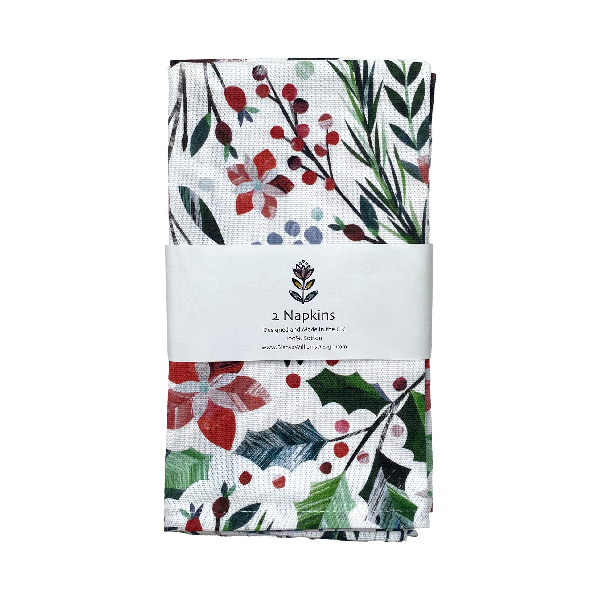 Winter Floral Napkins featuring red Poinsettia flowers and green holly with pine cones has been packaged in a branded belly band and placed on a white background.