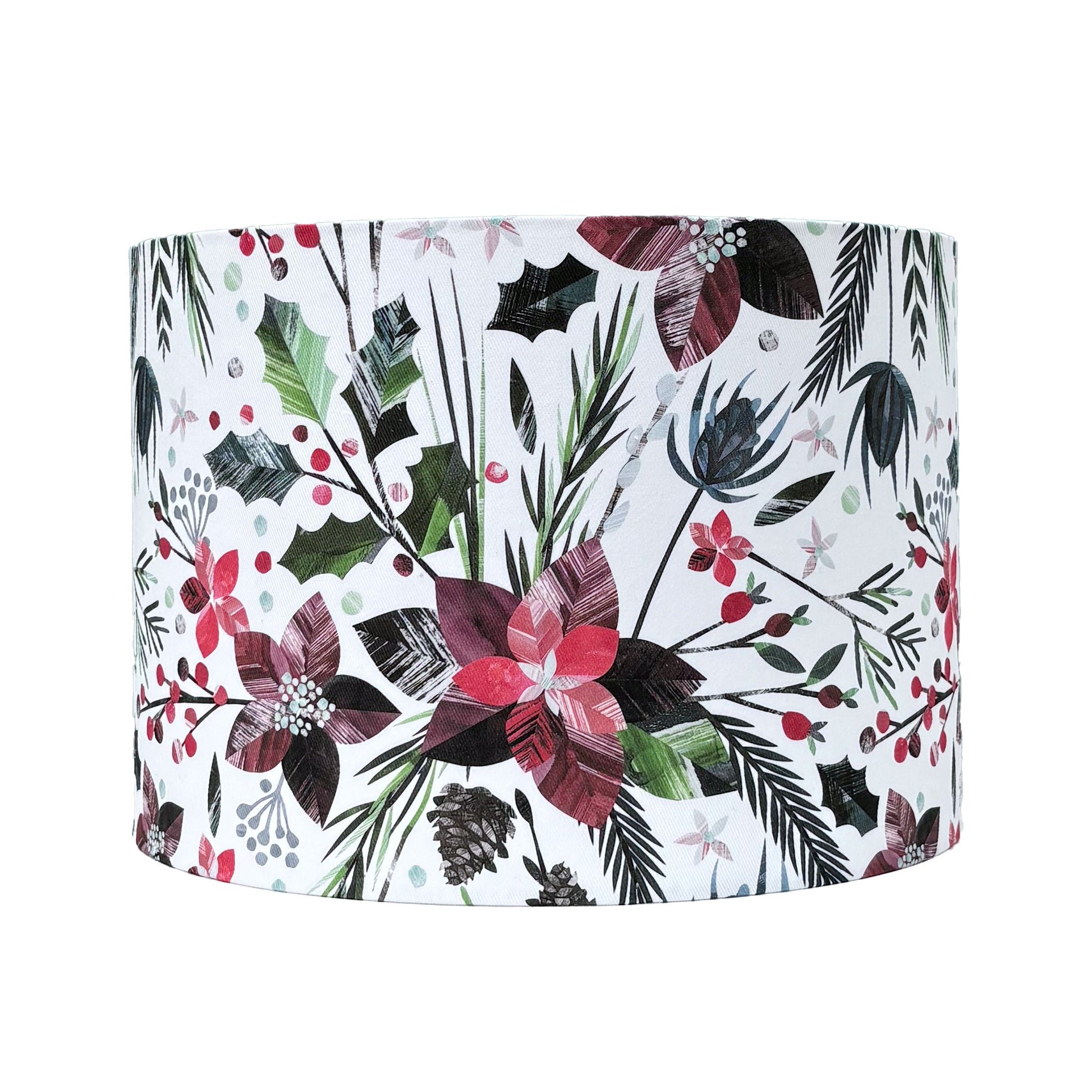 A medium sized Winter Floral Lampshade featuring textured red poinsettia flowers, green Holly, berries and fir has been placed on a white background.