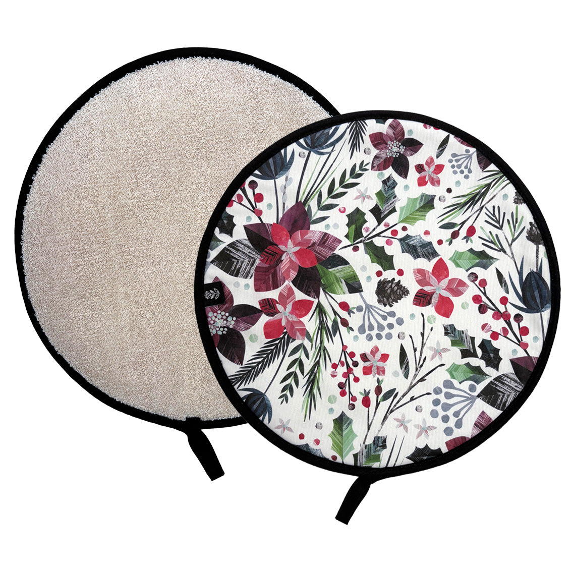 Two round Aga Covers are shown on a white background, one displaying the beige cotton towelling textured reverse side and the other a white front side with a colourful floral winter botanical print, featuring red poinsettia flowers and green Holly leaves.