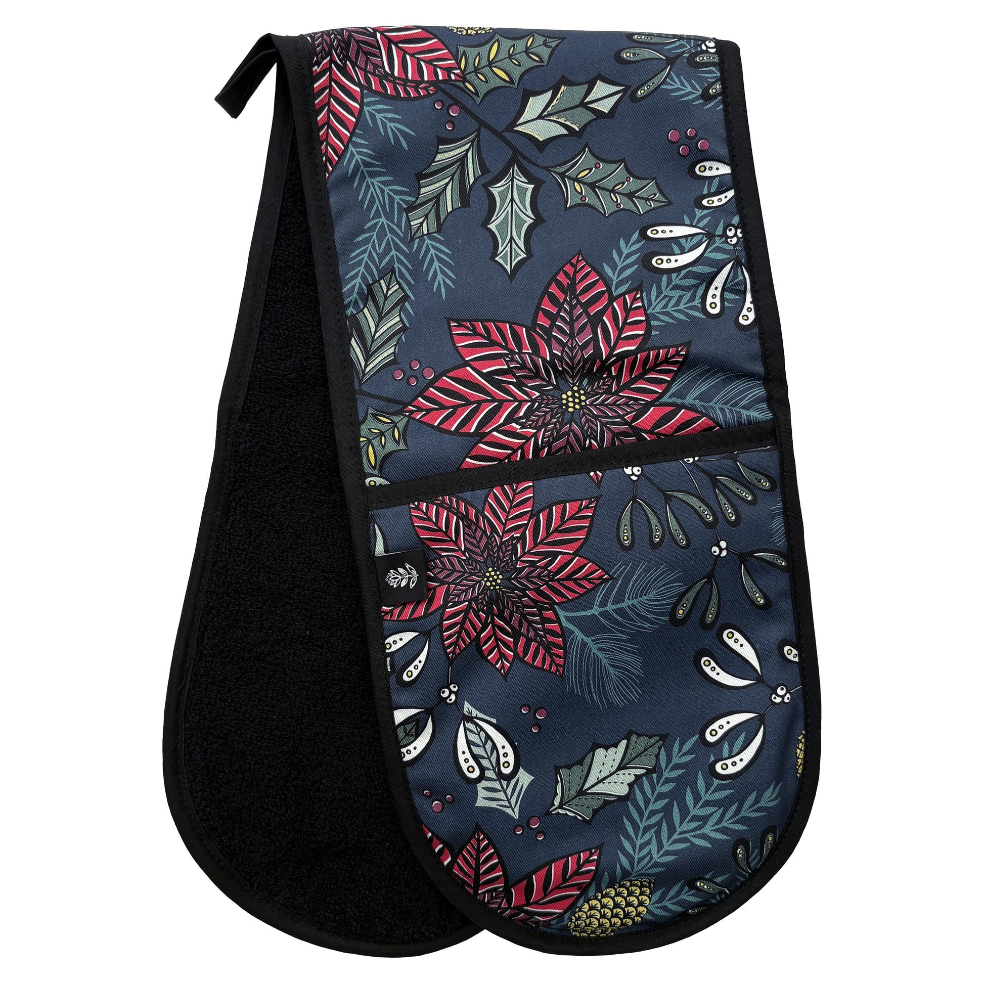 Pair of oven mitts with Red Poinsettia Flowers and Green Holly on a Navy base, have been placed at an angle on a white background so that you can see the black towelling backing.