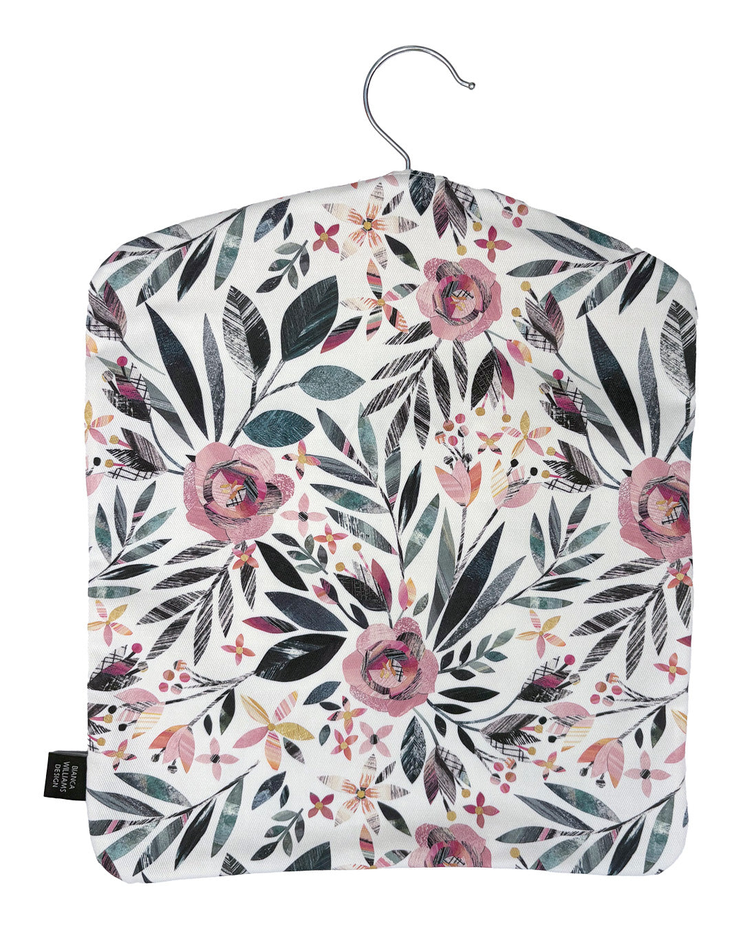 A Summer Floral peg bag has been placed on a white background.  You can see the metal hook coming out of the top and a black brand label has been sewn into the outside seam.