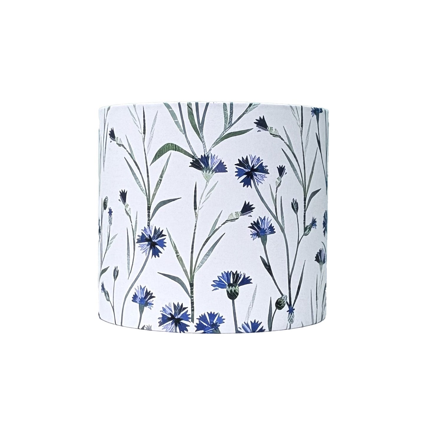 A small Floral patterned lampshade featuring Blue Cornflowers with green leaves on a white background.